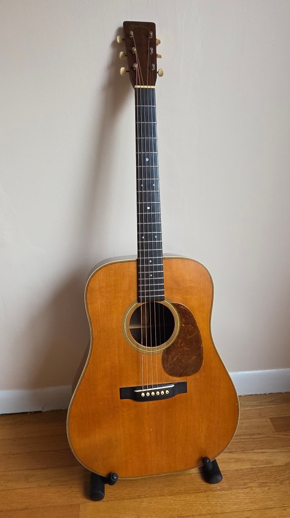 Martin dreadnaught guitar on a stand
